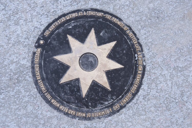 North Star plaque in the Cozad Bates House walkway, The North Star served as a guide on the dangerous Underground Railway journey.